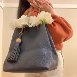 blue leather bucket bag